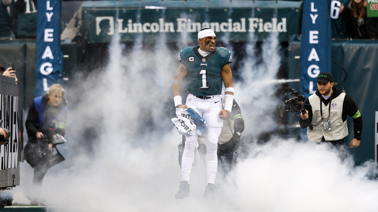 Jalen Hurts steps onto the Eagles' field in smoke