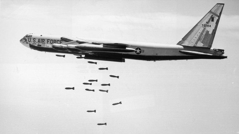 USAF plane dropping bombs over vietnam