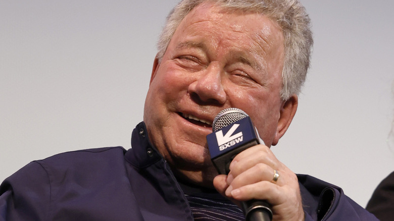 William Shatner smiles while speaking