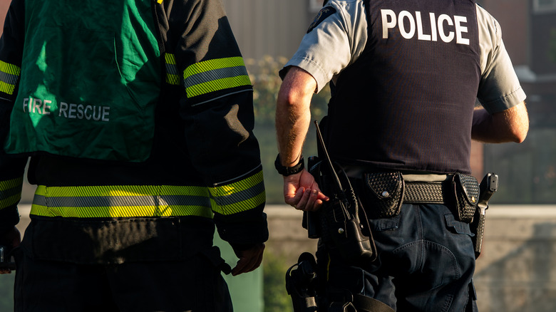 firefighter and police officer standing