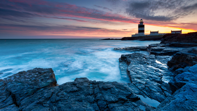 The sun sets on Hook Lighthouse, Wexford, Ireland 