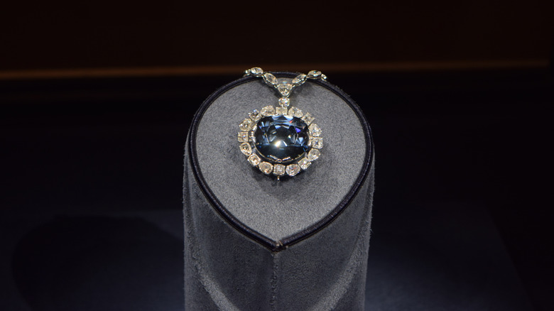 Hope Diamond in diamond necklace setting in museum display