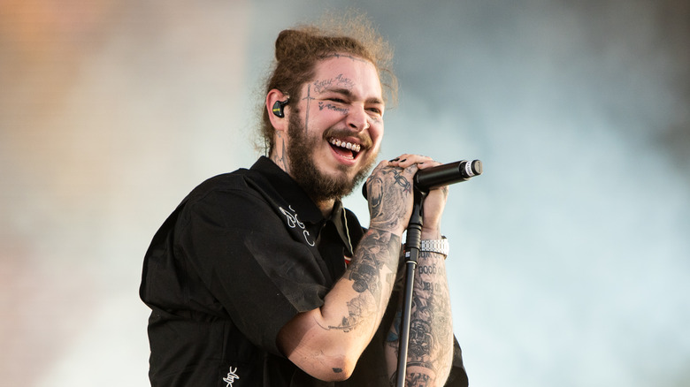Post Malone singing into microphone