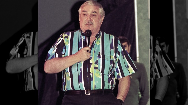 James Doohan speaking into microphone