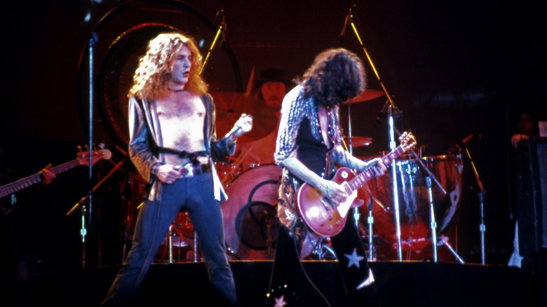 Robert Plant, Jimmy Page, and John Bonham of Led Zeppelin performing onstage