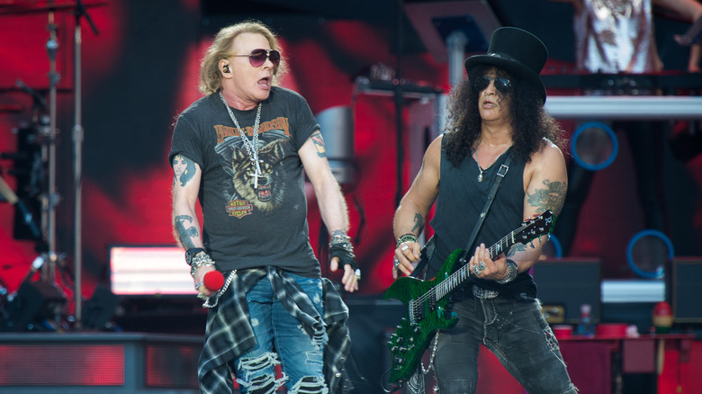 Guns N' Roses' Axl Rose and Slash performing on stage at the Stade de France in 2017