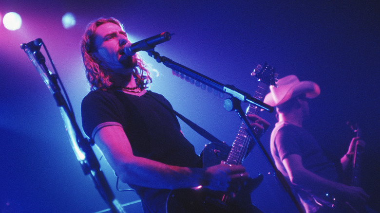 Nickelback's Chad Kroeger and Ryan Peake playing on stage in Belgium in 2002