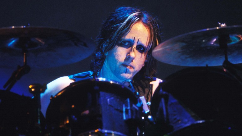 ginger fish looking worried while drumming for marilyn manson in 2002