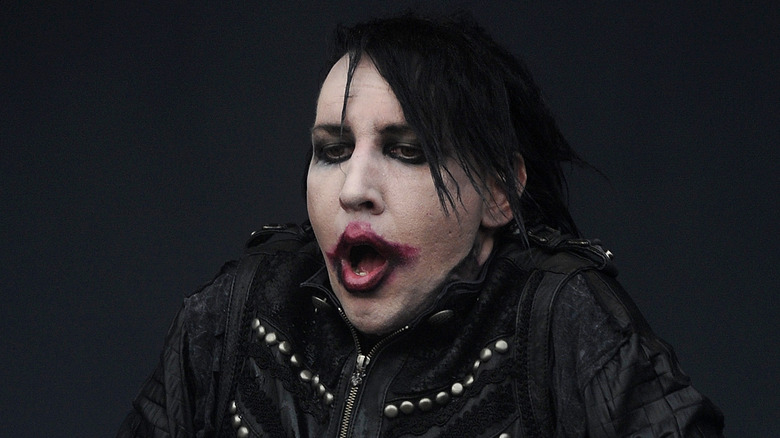 marilyn manson in makeup stares open mouthed at crowd at soundwave 2012