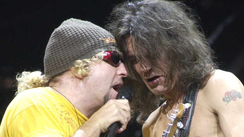 sammy hagar and eddie van halen close together onstage during 2004 concert