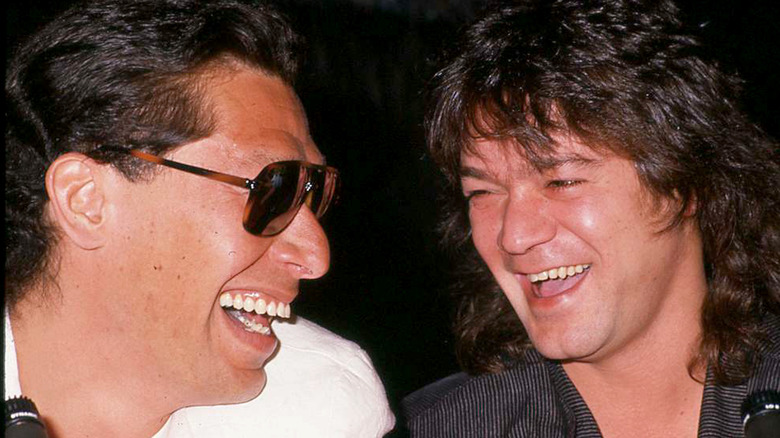 alex van halen and eddie van halen laughing together in the late 1980s