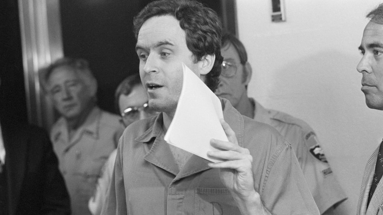 Ted Bundy holding paper