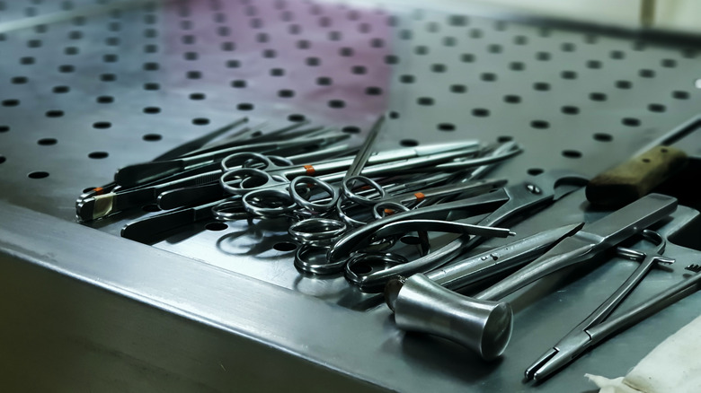 assorted medical tools on metal table