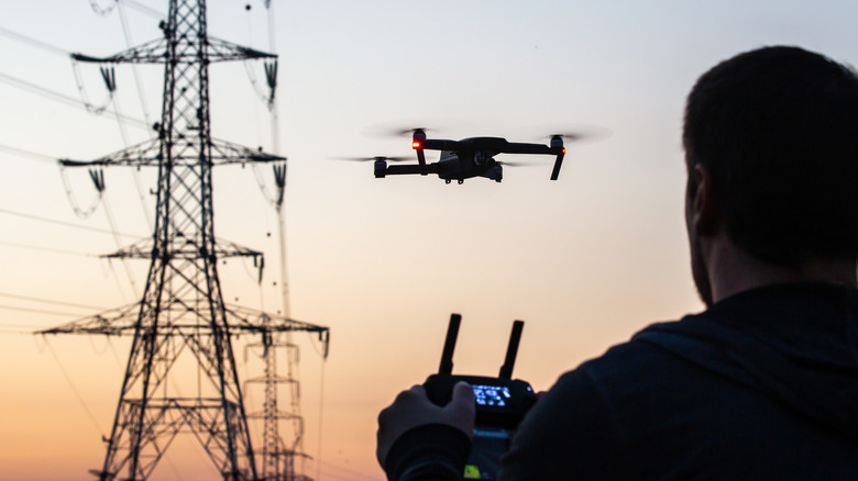 man operating drone