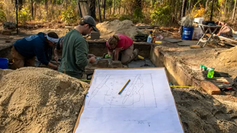 Archeologists work at the dig site in Camden