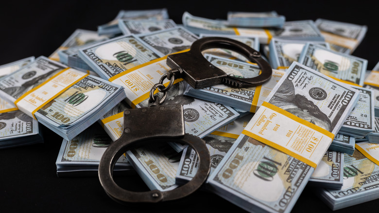 Handcuffs on pile of money