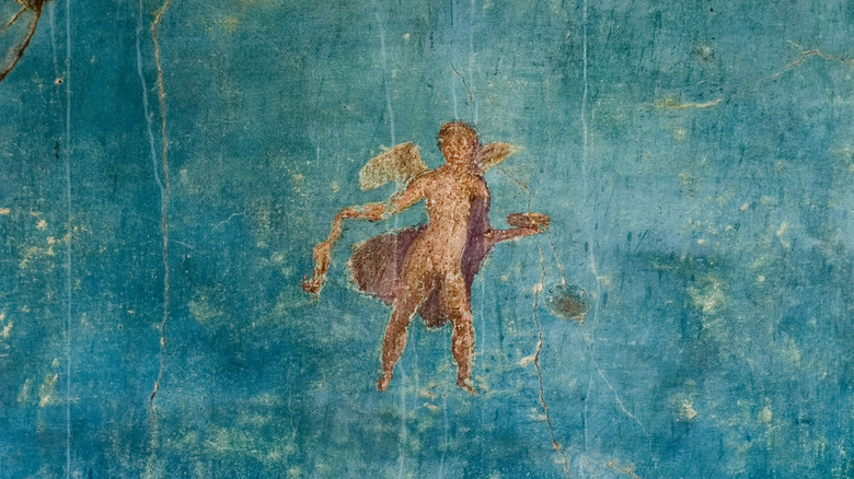 Detail on figure on blue wall in Pompeii