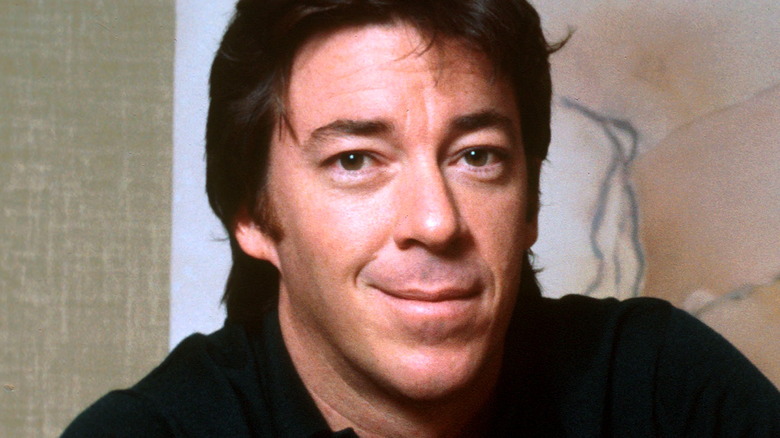 Boz Scaggs smirking black shirt