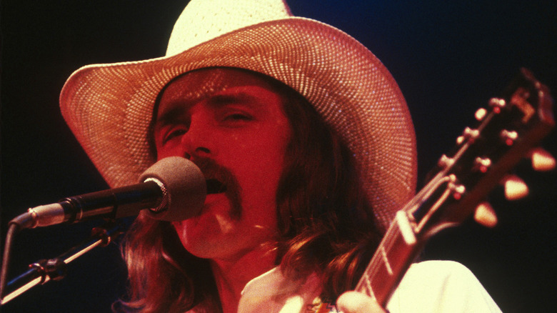 Dickey Betts sings and plays guitar