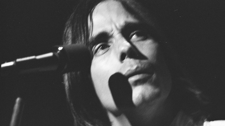 Jackson Browne behind a mic