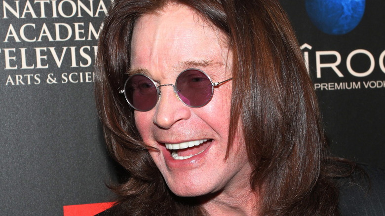 Ozzy Osbourne sunglasses laughing