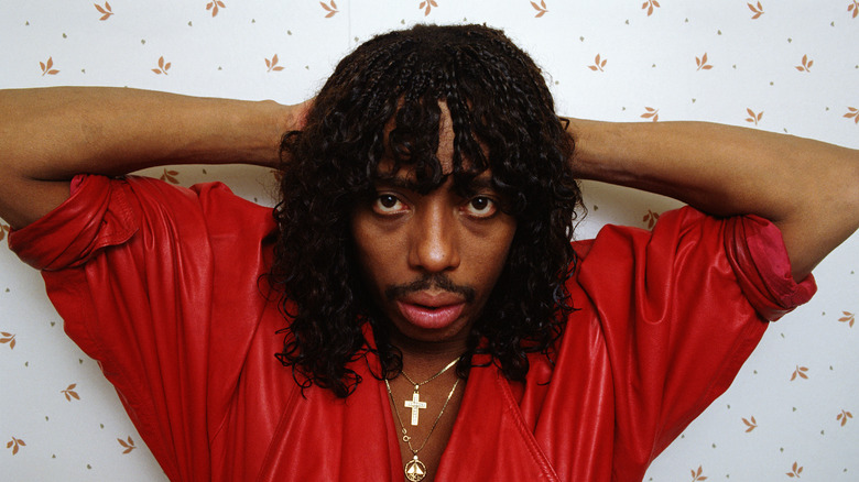 Rick James hands behind head