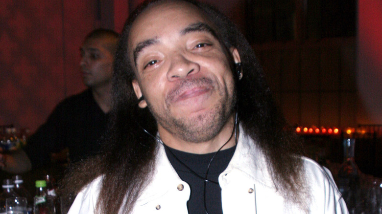 Kidd Creole smiling for photo in a club