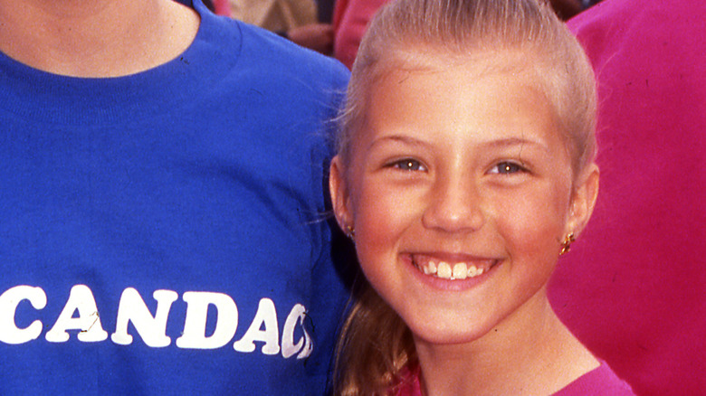 Jodie Sweetin smiling in 1990