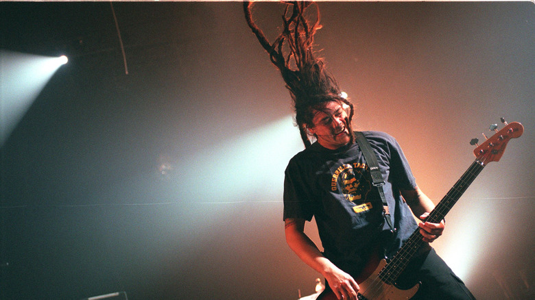 Deftones bassist Chi Cheng plays bass on stage