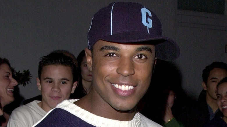 Merlin Santana smiling baseball cap