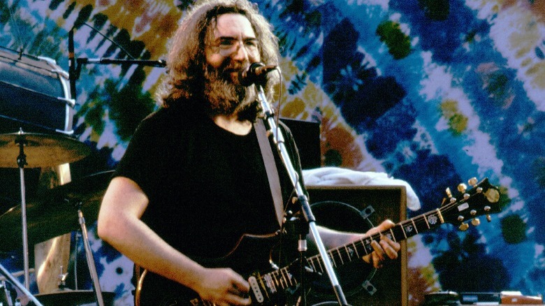Jerry Garcia playing guitar onstage