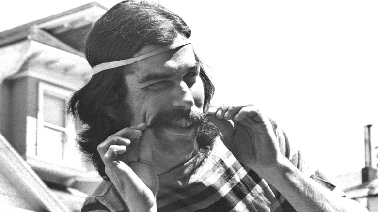 Mickey Hart pulling on mustache