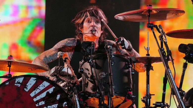 Tommy Lee playing drums, onstage