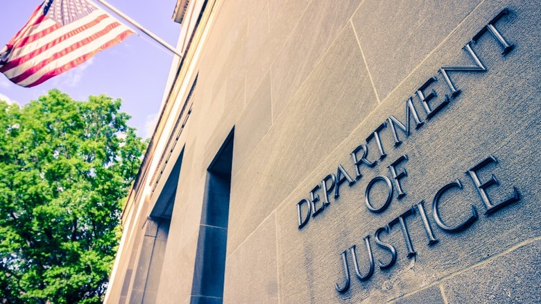 U.S. Department of Justice building facade with American flag