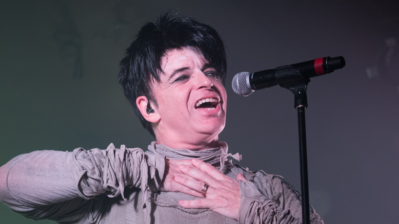 Gary Numan singing into microphone