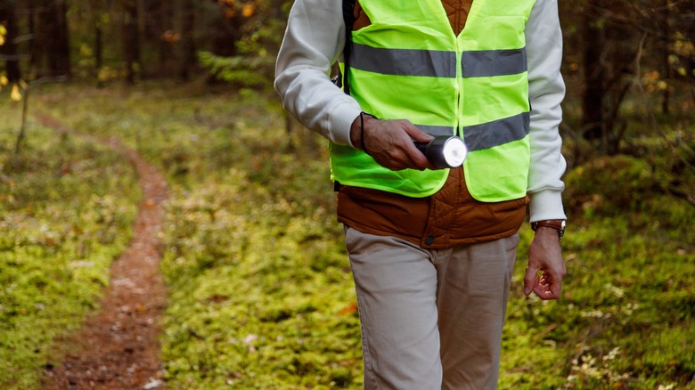 Rescue worker flashlight yellow vest