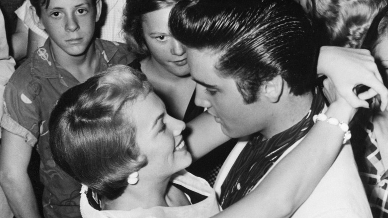 Elvis Presley Anita Wood embracing