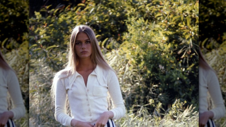 Peggy Lipton standing in field