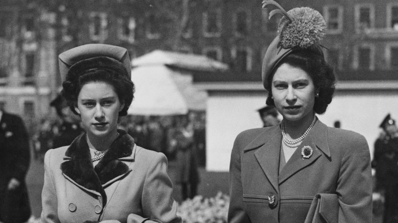 Margaret and Elizabeth II walk together