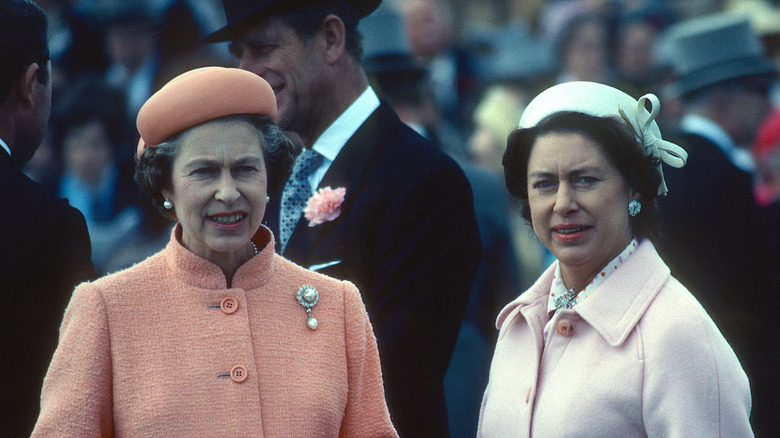 Elizabeth II and Margaret stand together
