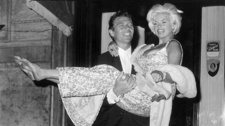 MIckey Hargitay carrying Jayne Mansfield