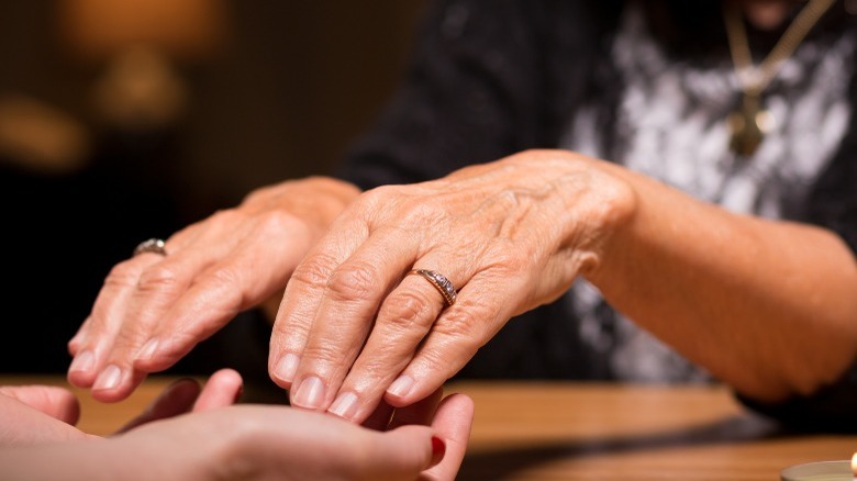 Hands at a séance