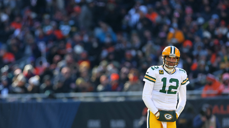 Aaron Rodgers standing before crowd