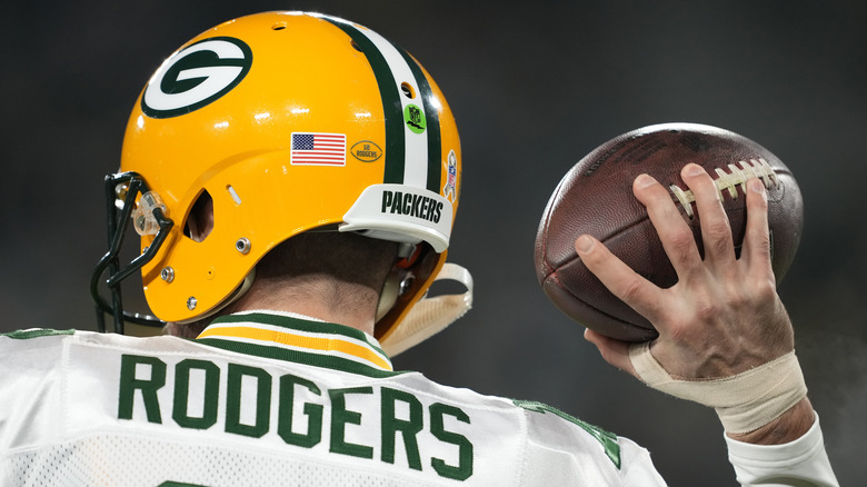 Aaron Rodgers holding a football