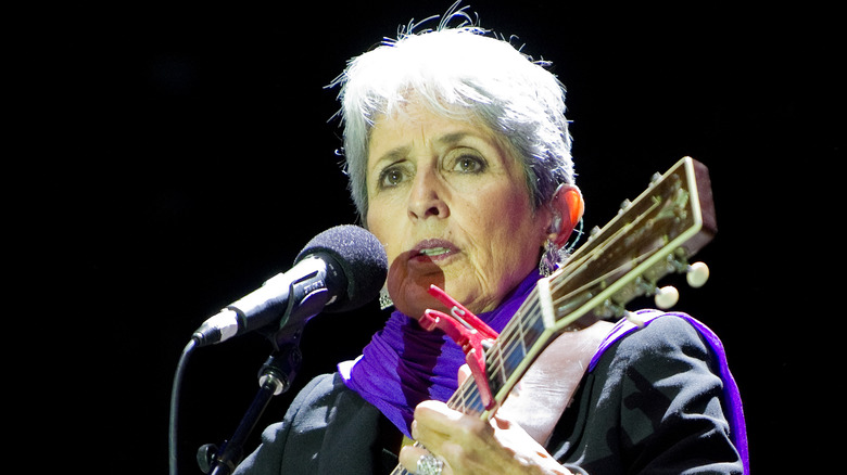 Joan Baez playing guitar