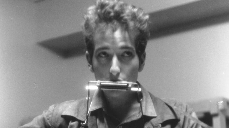 Bob Dylan playing harmonica