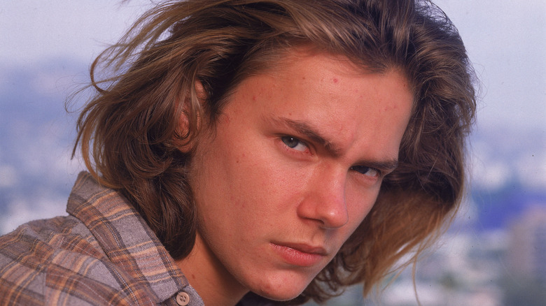 River Phoenix in a promotional headshot