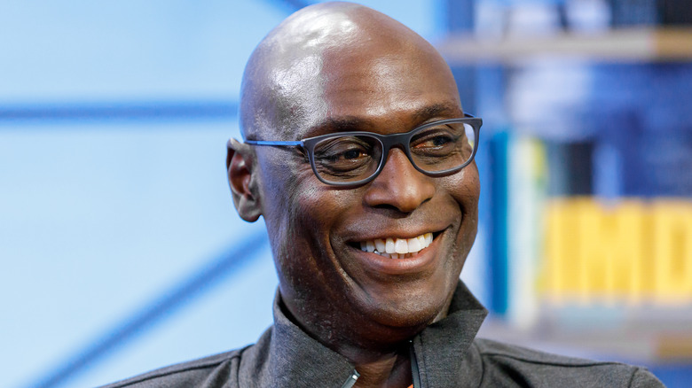 lance reddick smiling glasses