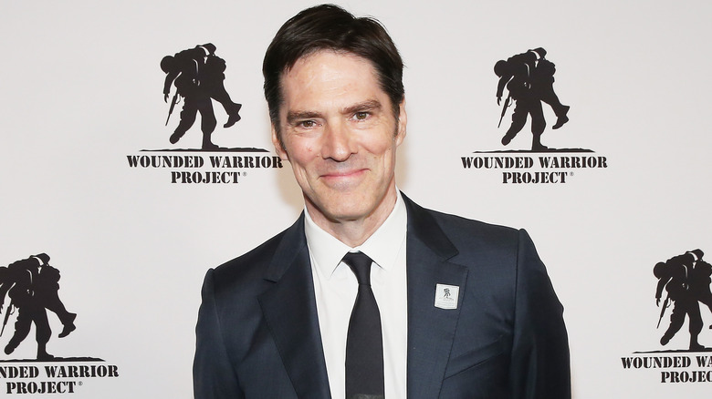 Thomas Gibson suit smiling at event