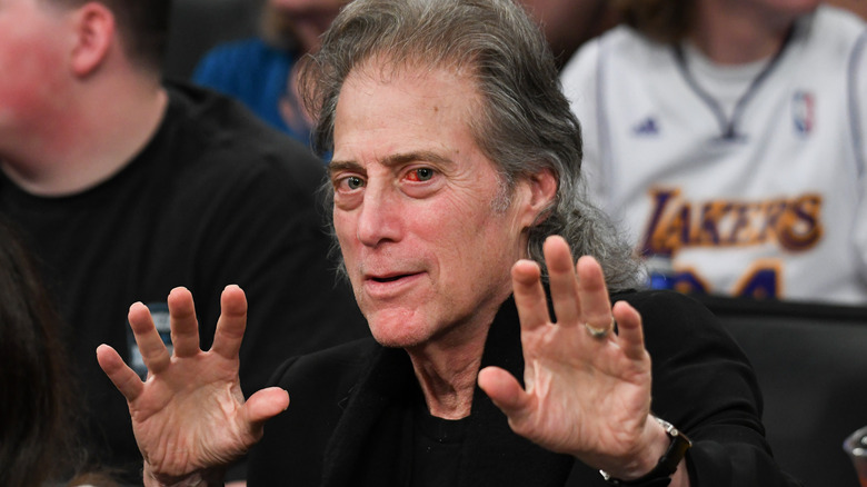 richard lewis holding up hands